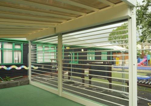 White transparent roller shutters for a playground, inside view